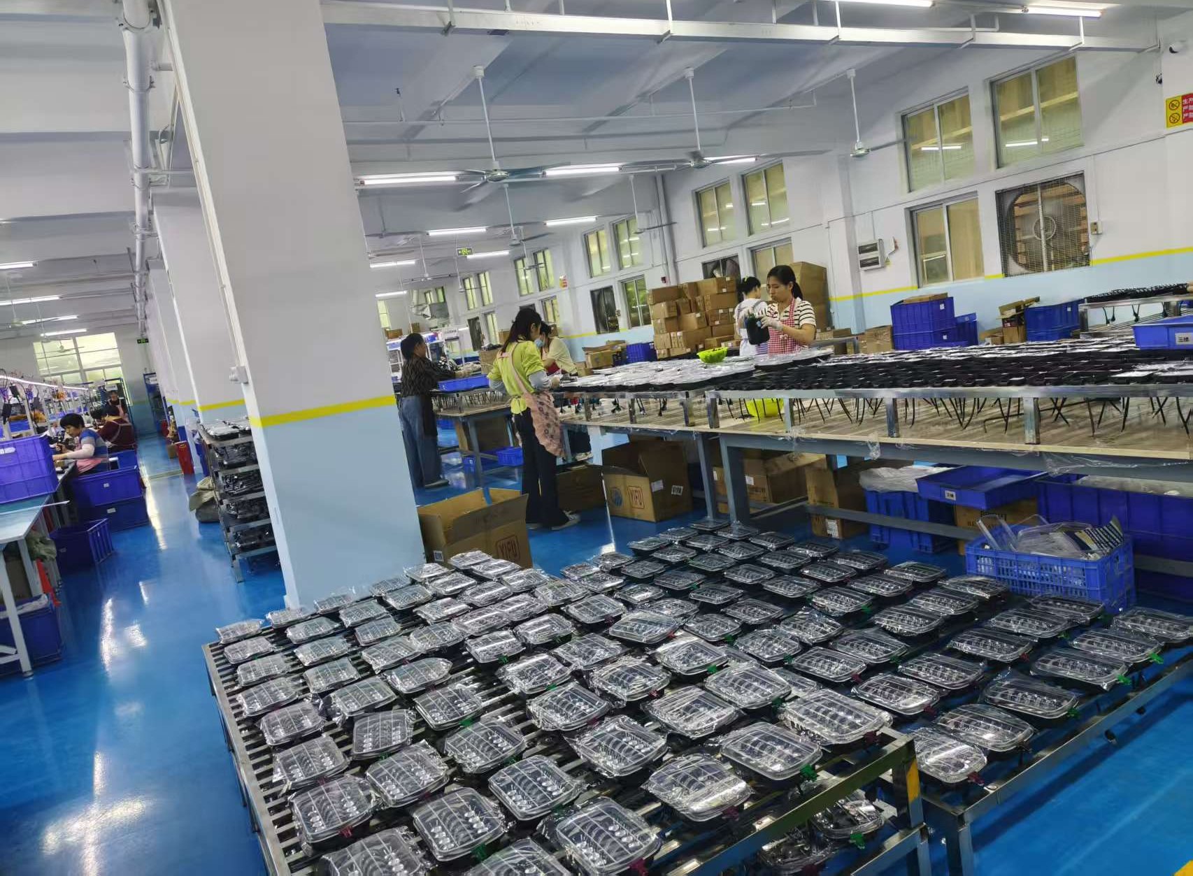 Lamps on production racks awaiting test and packing